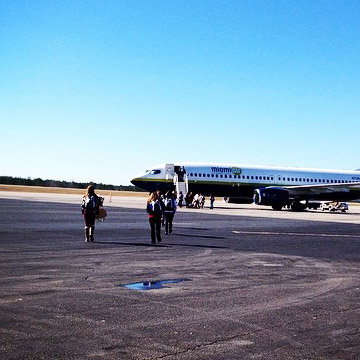 Band members boarding an airplane
