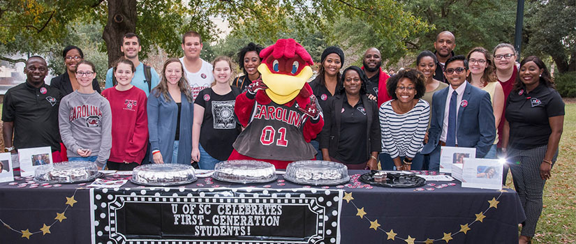 USC Mascot Cocky with a group of students at a First Generation Student celebration