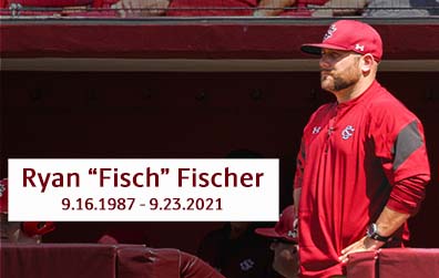 Ryan Fischer standing in the dugout of a USC Baseball game