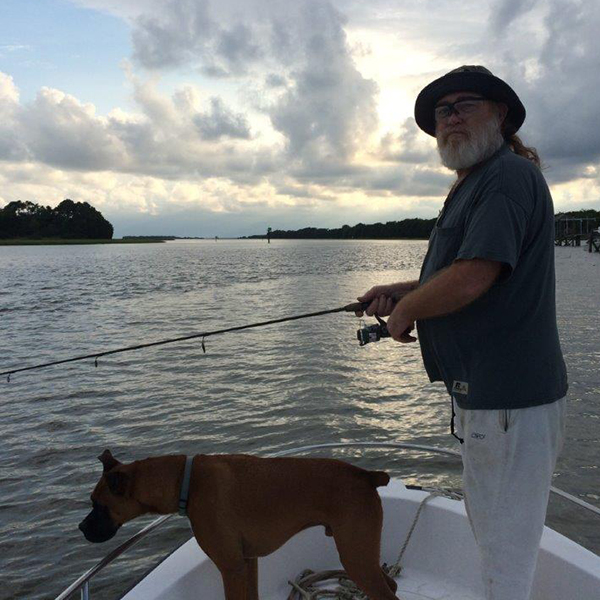 Dr Wally Peters fishing with his dog