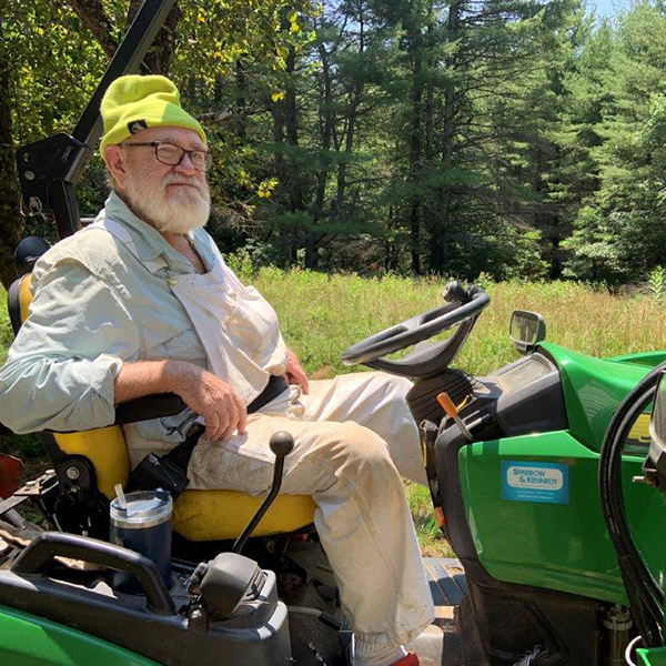 Dr Wally Peters on a John Deere tractor