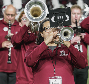 Carolina Marching Band member playing the trumpet